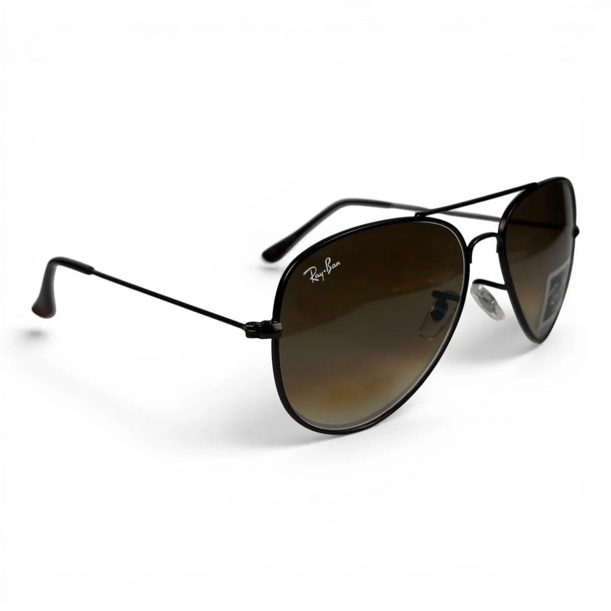 The Vela aviator sunglasses in black with brown gradient lenses, angled three-quarter view