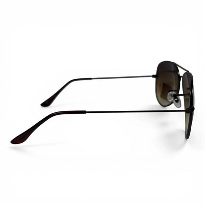 The Vela aviator sunglasses in black with brown gradient lenses, side profile view