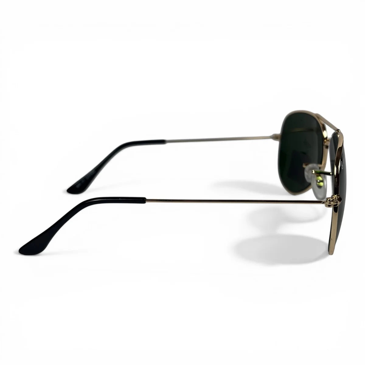 The Vela aviator sunglasses in gold with green lenses, side profile view