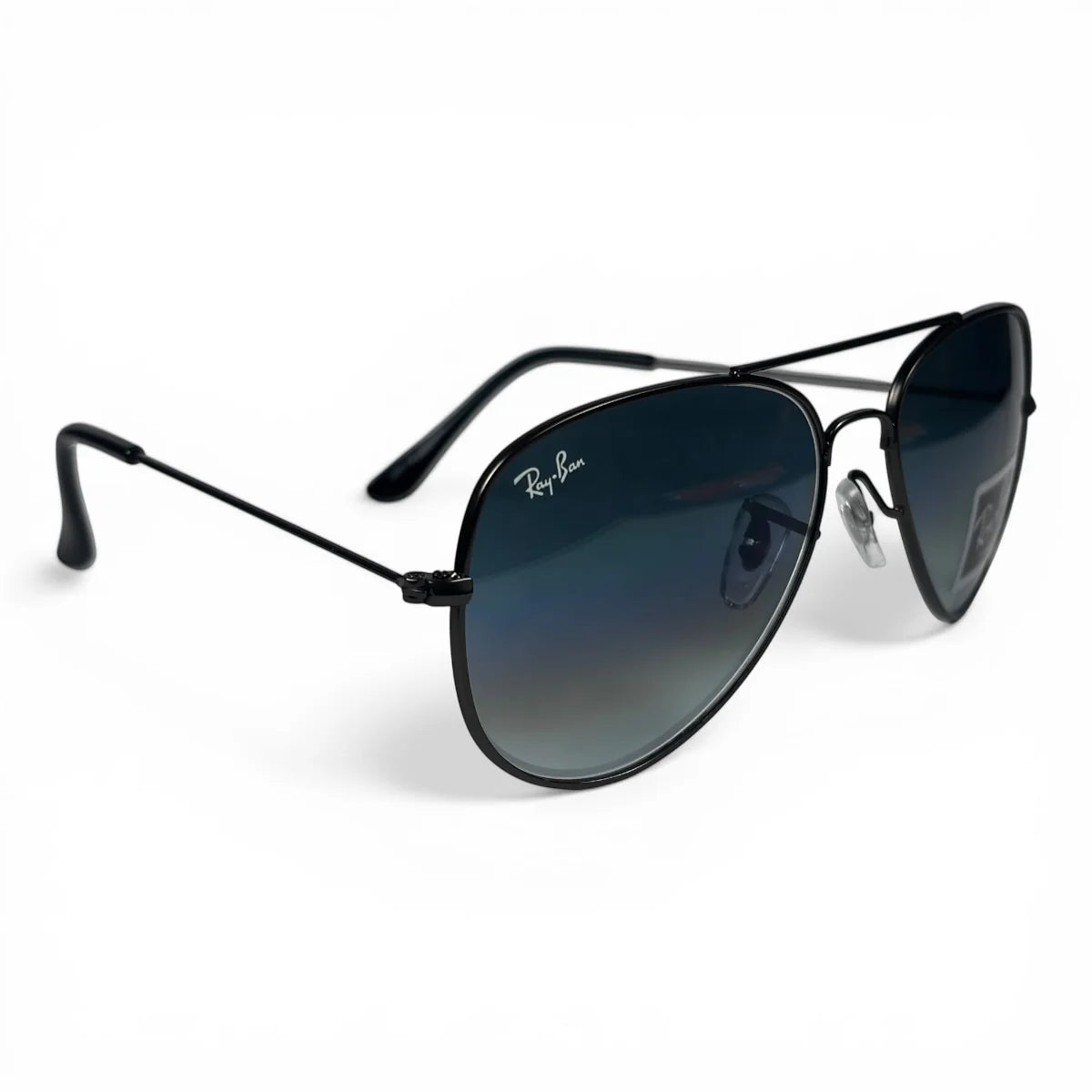 The Vela aviator sunglasses in gunmetal with blue gradient lenses, angled three-quarter view